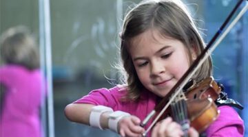 8-Year-Old Violinist Excels Beyond Measure Despite Hand Disability